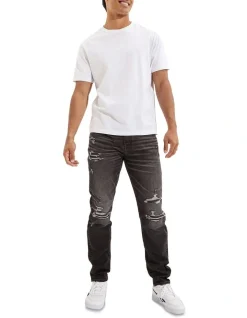 American Eagle AE AirFlex Patched Athletic Fit Jean In Black