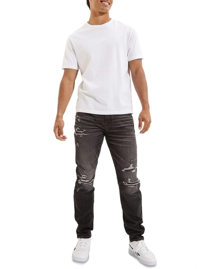 American Eagle AE AirFlex Patched Athletic Fit Jean In Black