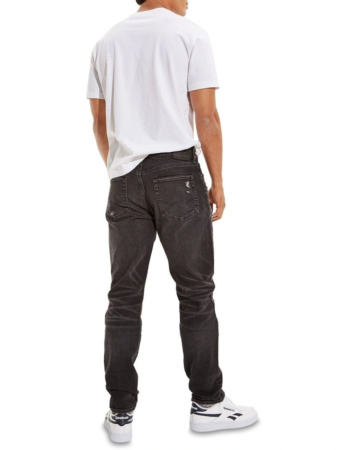 American Eagle AE AirFlex Patched Athletic Fit Jean In Black - Image 2