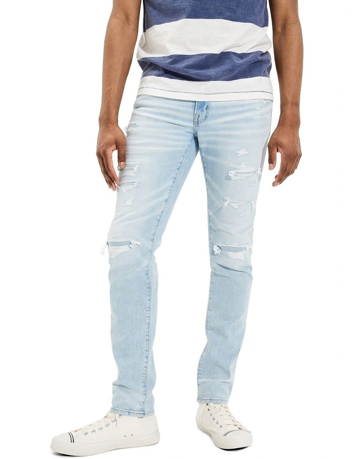 American Eagle AirFlex Patched Slim Jean In Light Destroy Wash In Blue 1 American Eagle AirFlex Patched Slim Jean In Light Destroy Wash In Blue