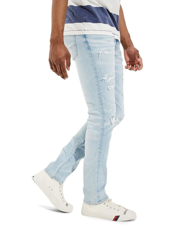 American Eagle AirFlex Patched Slim Jean In Light Destroy Wash In Blue 2 American Eagle AirFlex Patched Slim Jean In Light Destroy Wash In Blue - Image 2